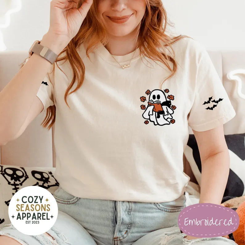 Embroidered Comfort Colors Halloween Book Shirt - Spooky Ghost Reading a Book Holding Black Cat in the Fall with Bat Sleeves