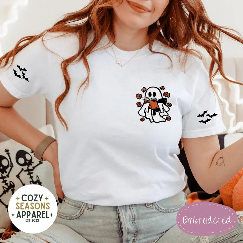 Embroidered Comfort Colors Halloween Book Shirt - Spooky Ghost Reading a Book Holding Black Cat in the Fall with Bat Sleeves