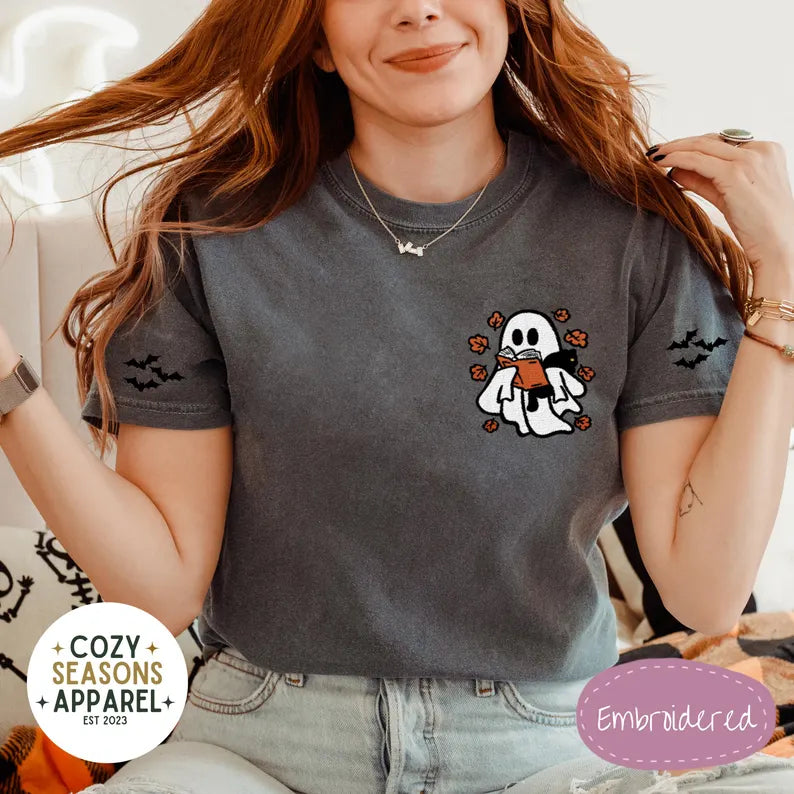 Embroidered Comfort Colors Halloween Book Shirt - Spooky Ghost Reading a Book Holding Black Cat in the Fall with Bat Sleeves